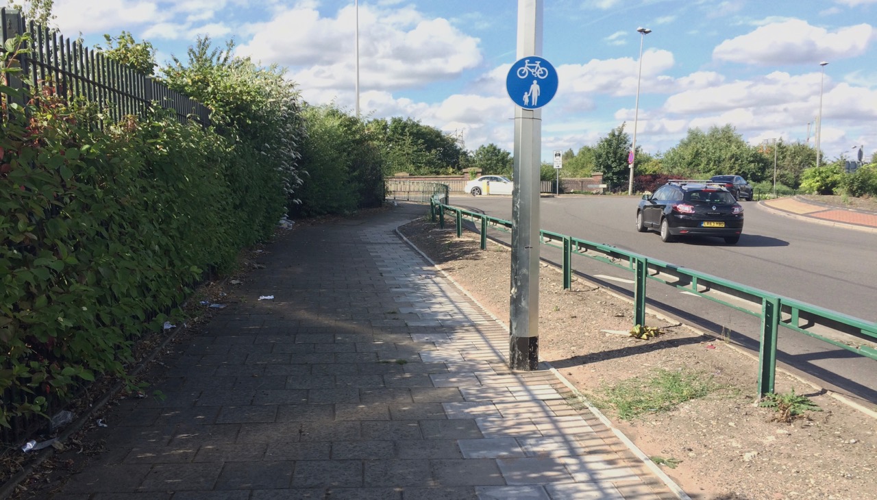 Paved footpath next to junction with Aston Church Road