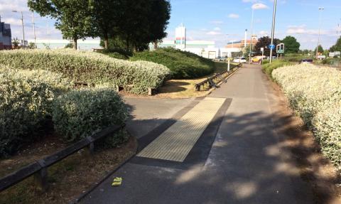 Textured tiles at a pedestrian entrance to Fort Shopping Centre.