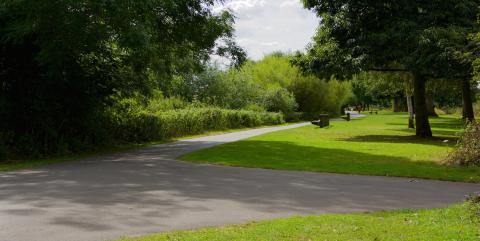 A path leading along the side of the River Severn in Worcester