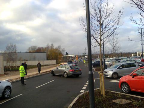 Staff control the traffic in the car park at the new Sainsbury's in Selly Oak