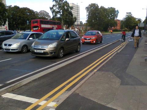 Segregated cycle lane along Pershore Road approaching the Priory Road junction