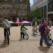 children and adults with bikes