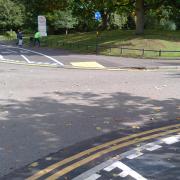The entrance to Cannon Hill car park, with give-way markings for the cycle track.