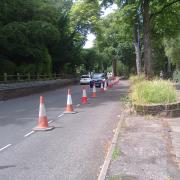 Parking has been suspended, and suddenly there is space for bidirectional motor traffic and a bidirectional cycleway