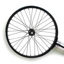 Magnifying glass with a bicycle wheel in place of the lens