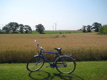 Bicycle with wind turbines behind