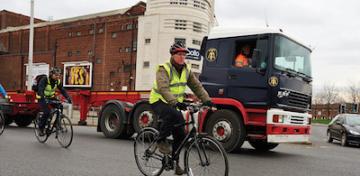 Cycle users next to lorry